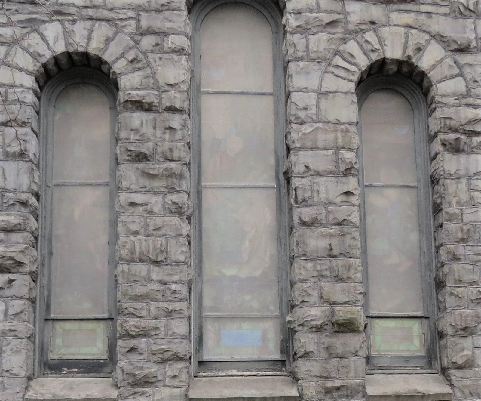 Egan Church Restorations Before stained glass window protective coverings